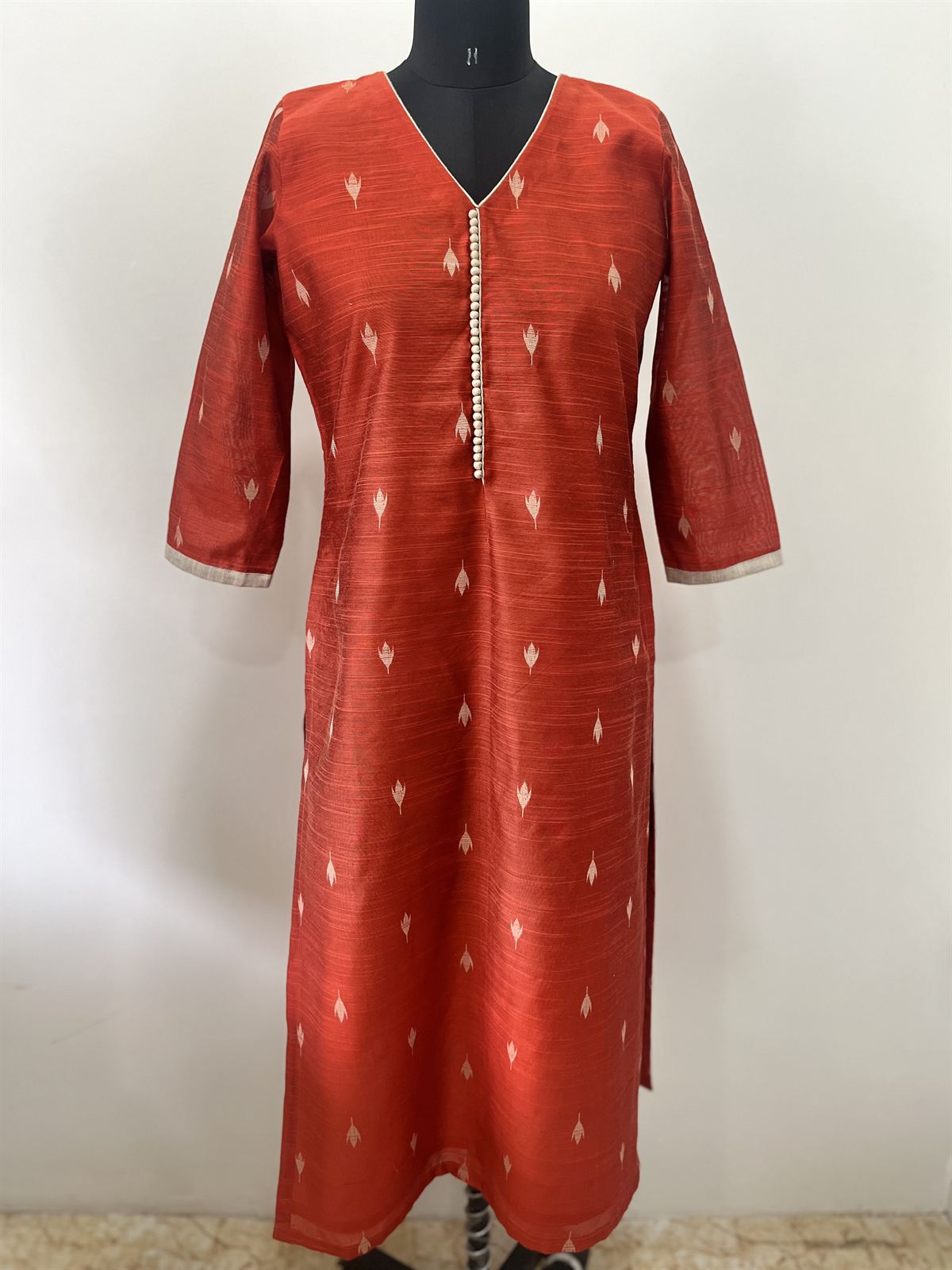 Rust raw silk kurta with small woven motifs